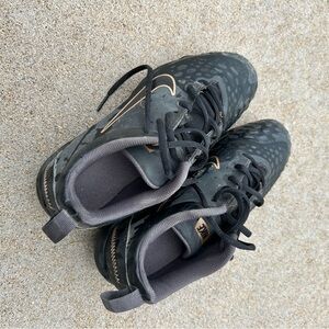 Size 7.5 girls, softball cleats, slightly dirty on the bottom.